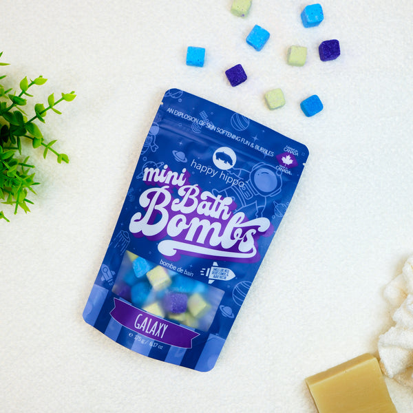 Galaxy mini bath bombs bag on a white background with bath bombs and soap.